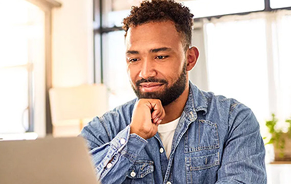 Man using computer at home