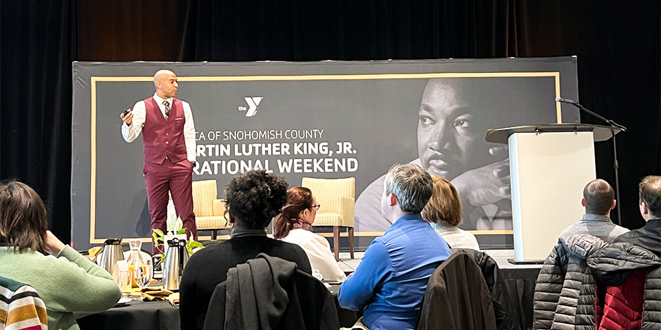 Eric M. Baley onstage at YMCA of Snohomish County Martin Luther King, Jr. event