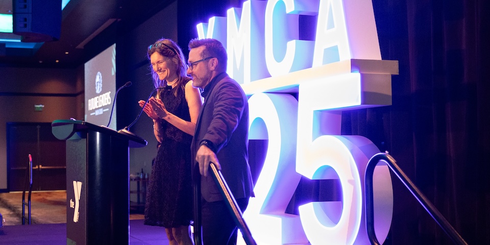 LifeWise CEO Kristin Meadows on stage at YMCA